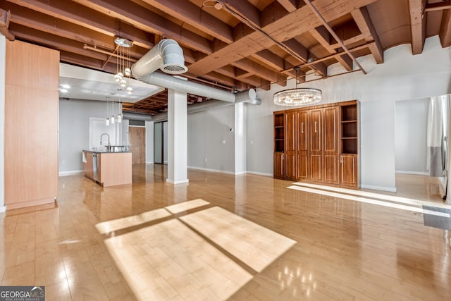 interior space featuring light wood-type flooring and sink