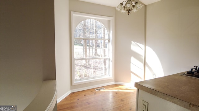 dining room with a chandelier and light hardwood / wood-style floors