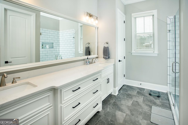 bathroom with a shower with door and vanity