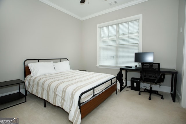 carpeted bedroom featuring ceiling fan and ornamental molding