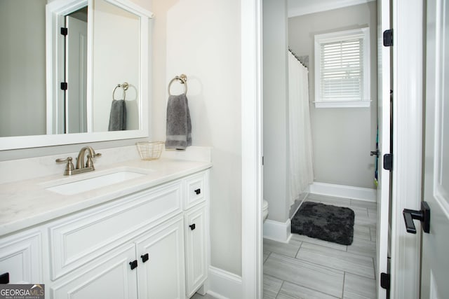 bathroom with vanity and toilet