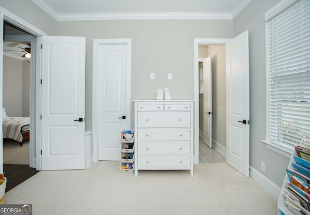 carpeted bedroom featuring ornamental molding