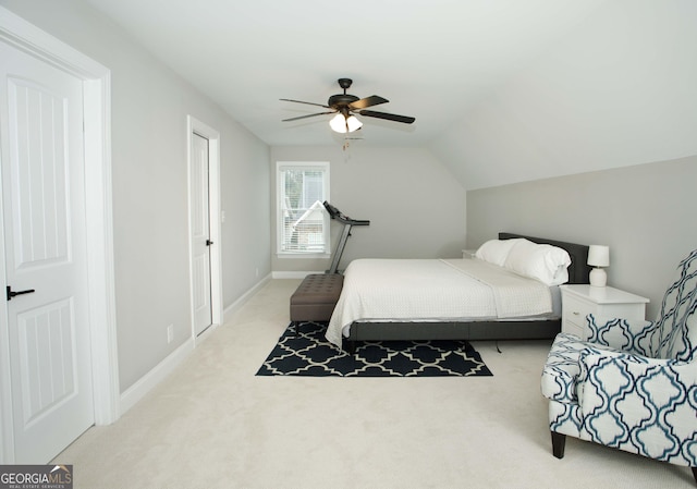 carpeted bedroom featuring ceiling fan and lofted ceiling