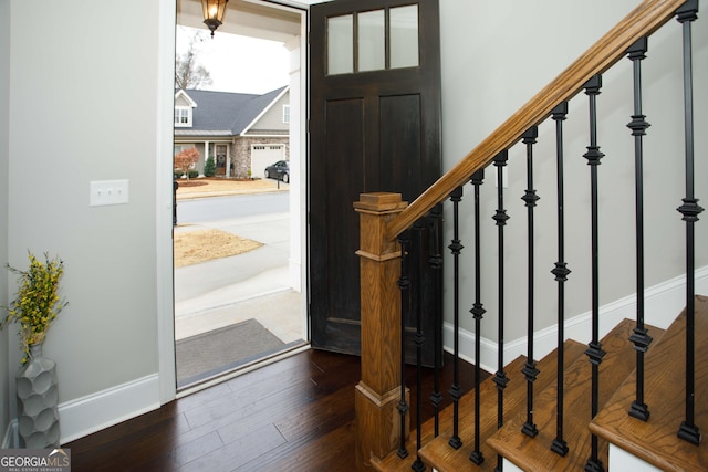 entrance foyer featuring dark hardwood / wood-style floors