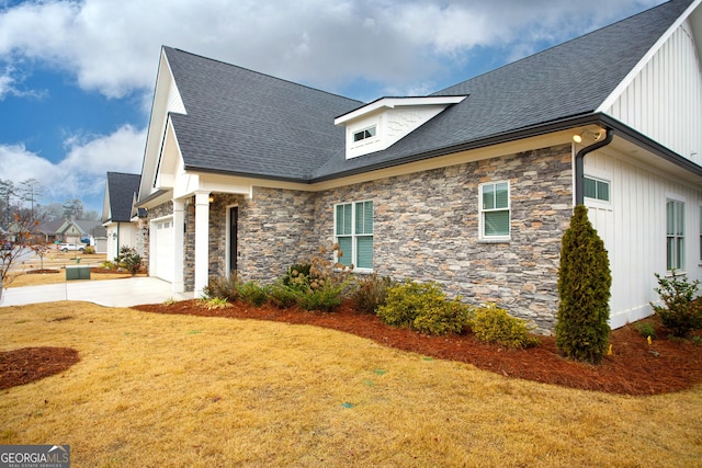 view of side of home featuring a lawn