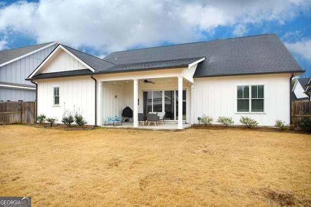 rear view of property featuring a lawn, ceiling fan, and a patio