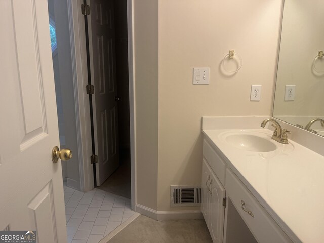 bathroom featuring tile patterned floors and vanity