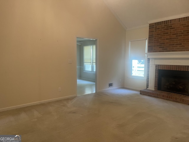 unfurnished living room with a fireplace, ornamental molding, light carpet, and high vaulted ceiling