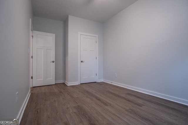 spare room with hardwood / wood-style floors