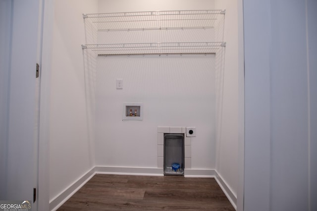 clothes washing area with dark wood-type flooring, washer hookup, and hookup for an electric dryer