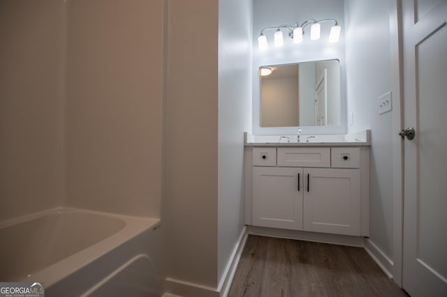 bathroom featuring vanity and wood-type flooring