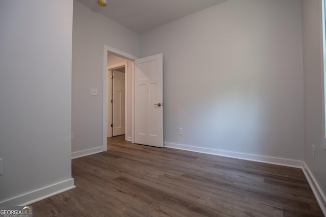 empty room featuring dark hardwood / wood-style floors