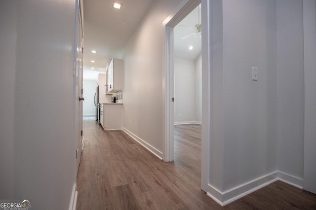 hall with hardwood / wood-style floors