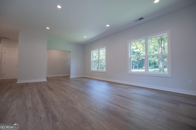 unfurnished room with dark hardwood / wood-style floors