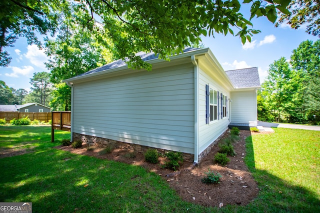 view of home's exterior with a yard