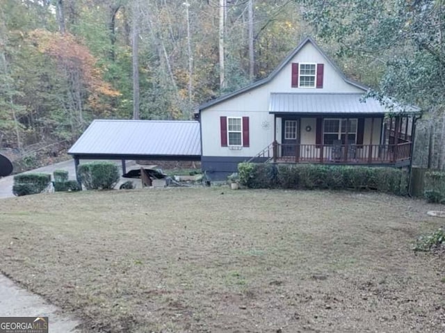 view of front facade with a front lawn and covered porch