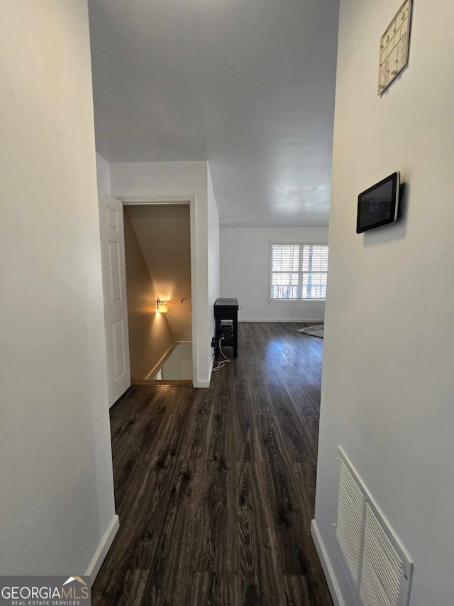 hall with dark hardwood / wood-style floors