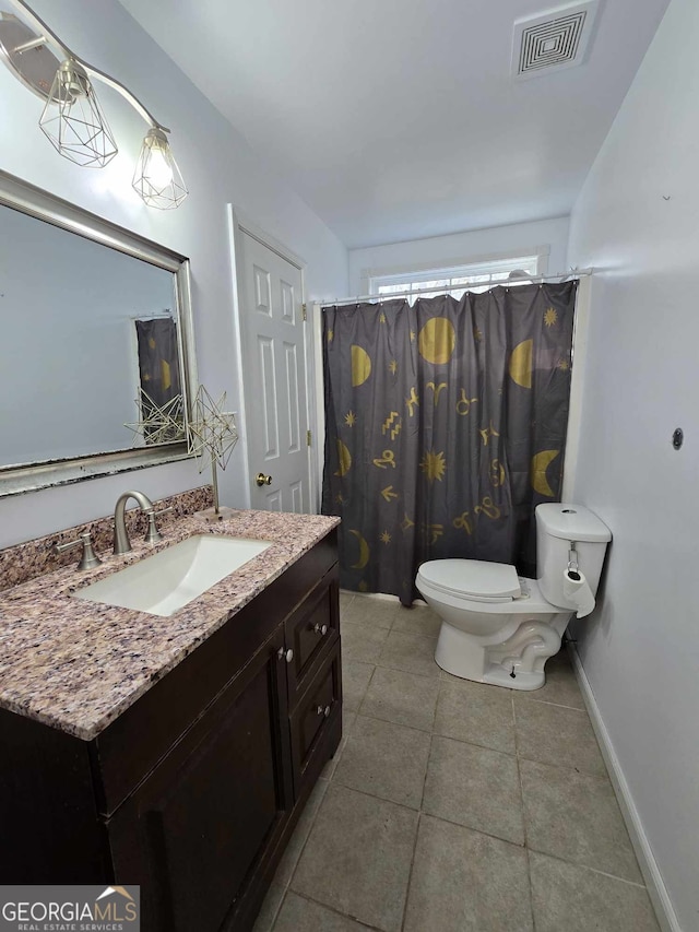 bathroom featuring a shower with curtain, vanity, toilet, and tile patterned floors