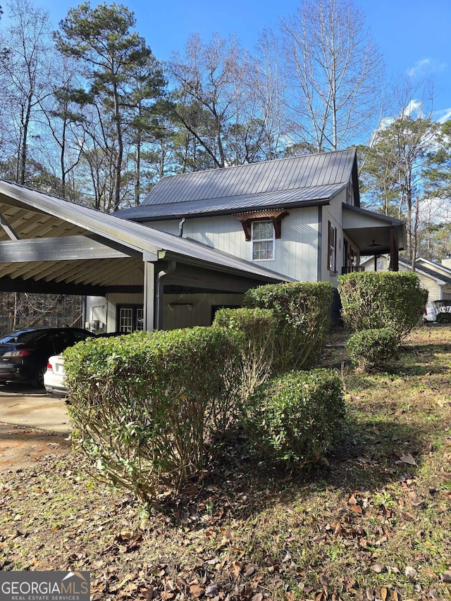 view of home's exterior with a carport