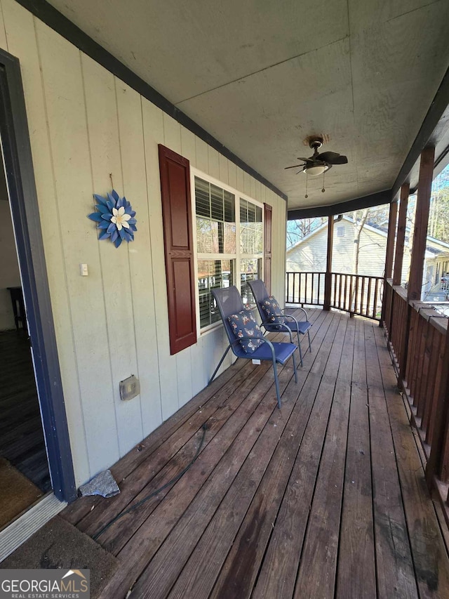 deck featuring ceiling fan and a porch