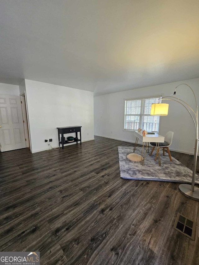 living room featuring dark hardwood / wood-style flooring