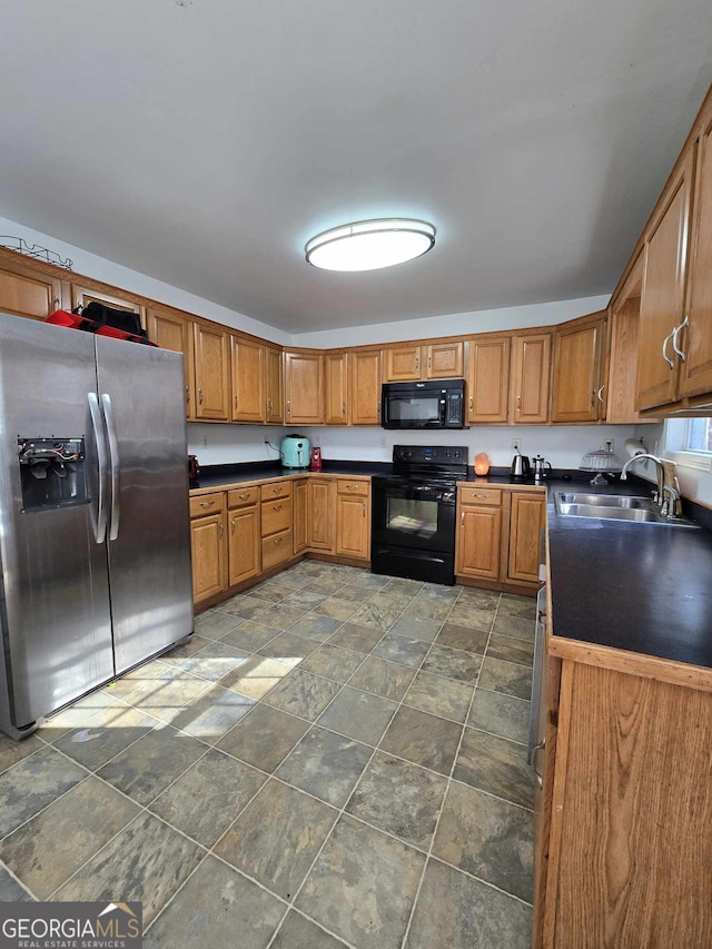 kitchen featuring black appliances and sink