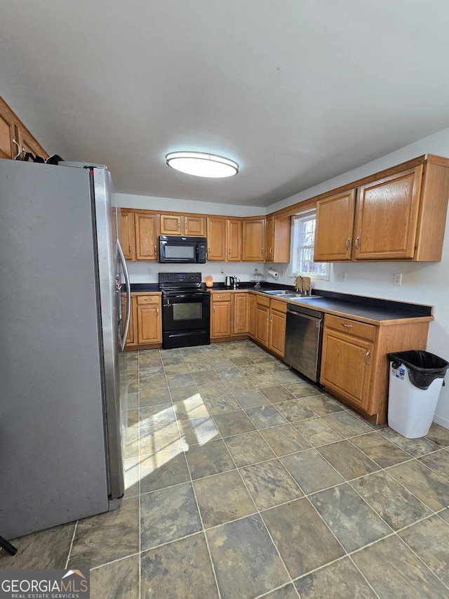 kitchen featuring black appliances and sink