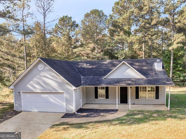 ranch-style house with covered porch, a front yard, and a garage