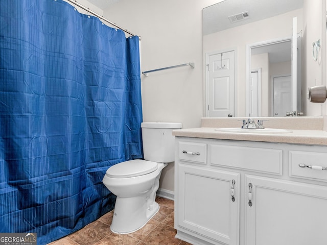 bathroom featuring a shower with curtain, tile patterned flooring, vanity, and toilet