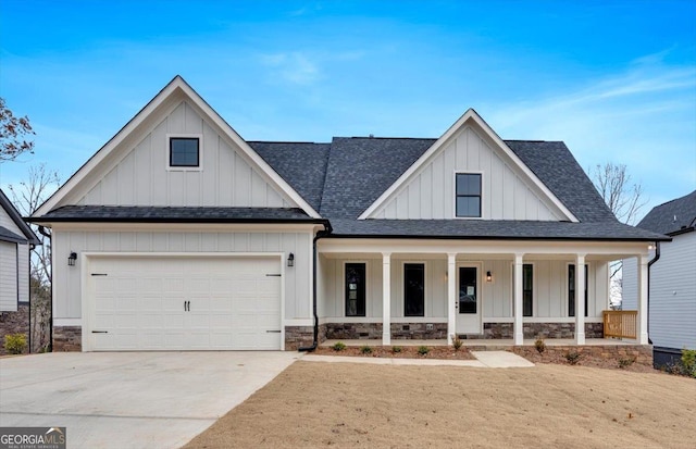 view of front of home with a porch and a garage