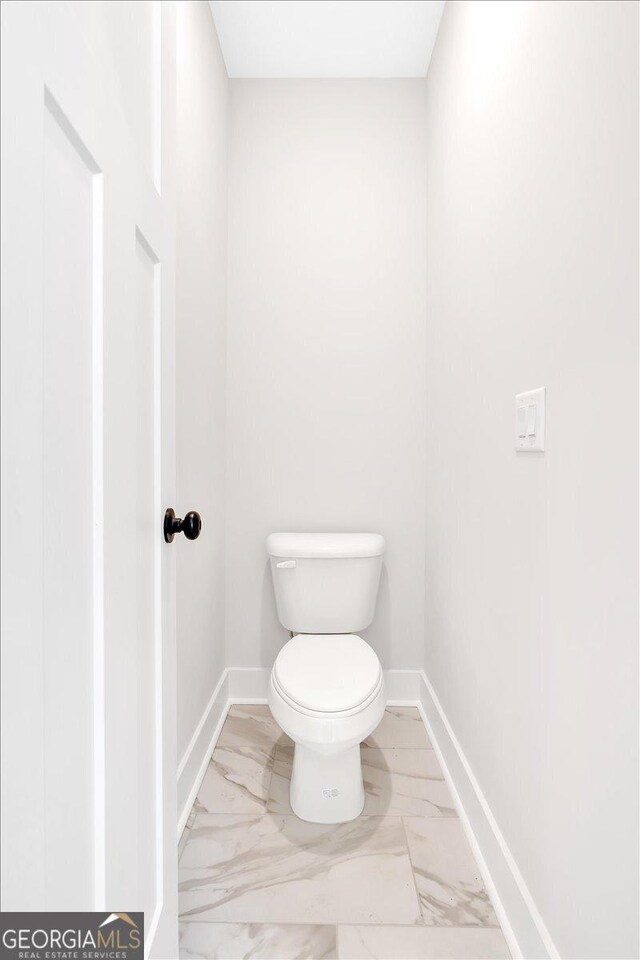 bathroom featuring toilet