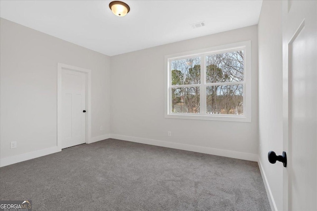 unfurnished room with carpet