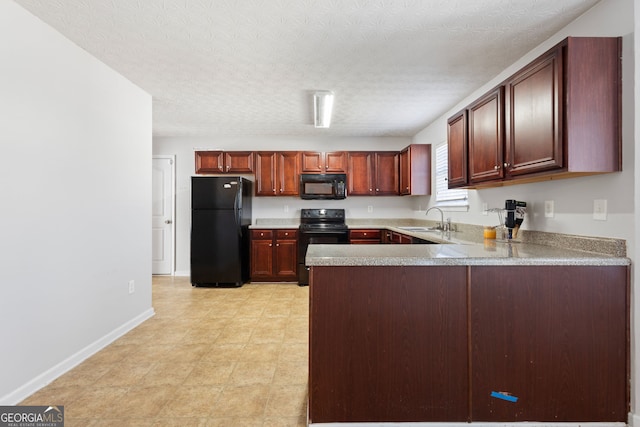 kitchen featuring black appliances, kitchen peninsula, sink, and a textured ceiling