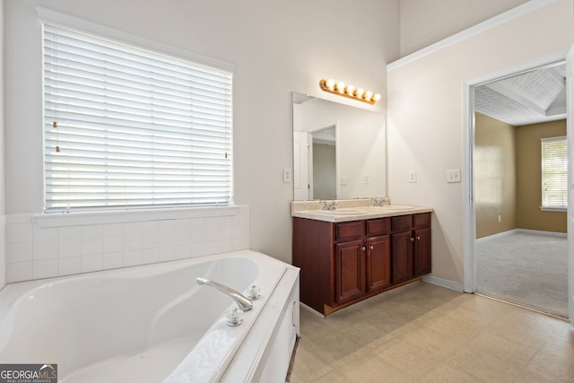 bathroom with a bathing tub and vanity