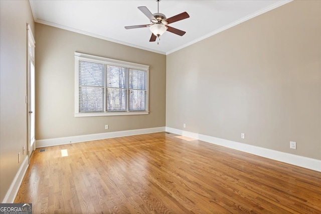 unfurnished room featuring ceiling fan, light hardwood / wood-style flooring, and ornamental molding