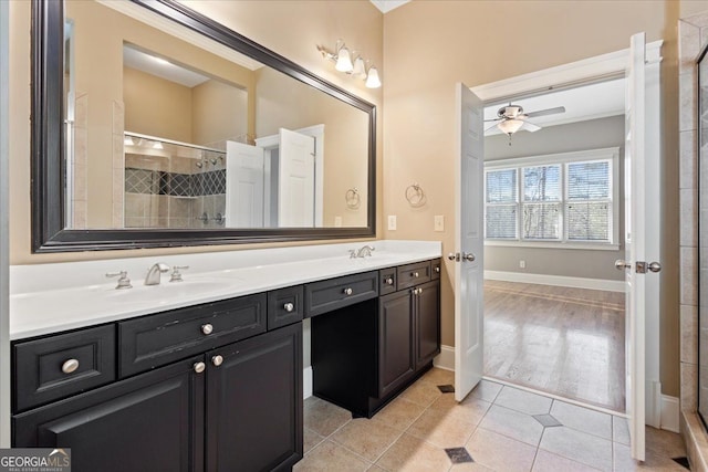 bathroom featuring walk in shower, vanity, tile patterned floors, and ceiling fan