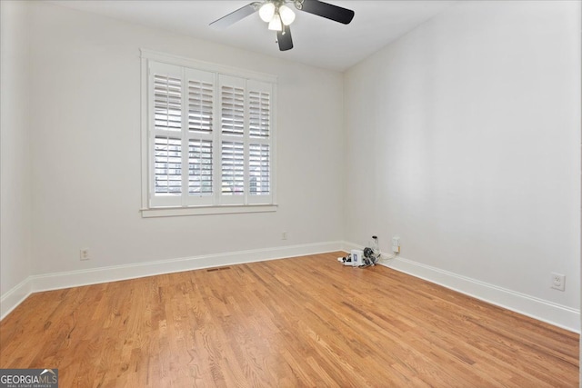 spare room with ceiling fan and light hardwood / wood-style floors