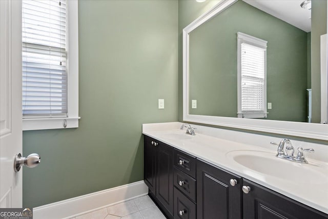 bathroom featuring tile patterned flooring and vanity