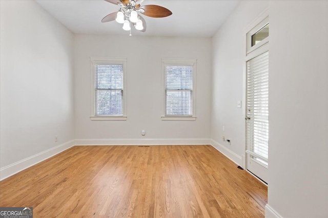 spare room featuring ceiling fan and light hardwood / wood-style floors