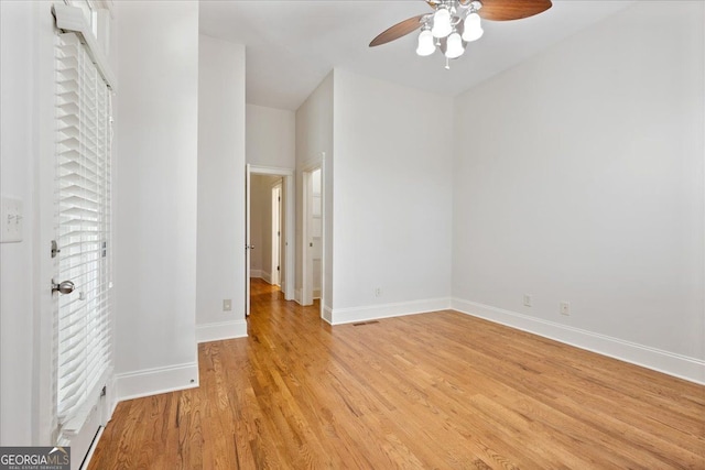 unfurnished room with light hardwood / wood-style flooring and ceiling fan