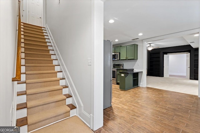 stairway with ceiling fan