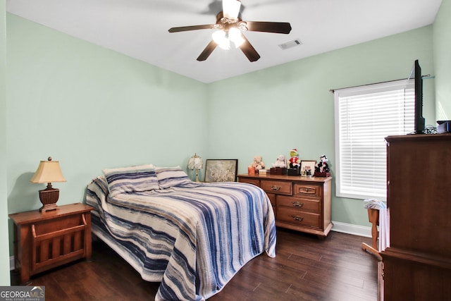 bedroom featuring ceiling fan and dark wood-type flooring