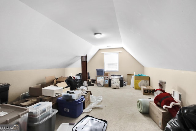 bonus room with carpet floors and lofted ceiling