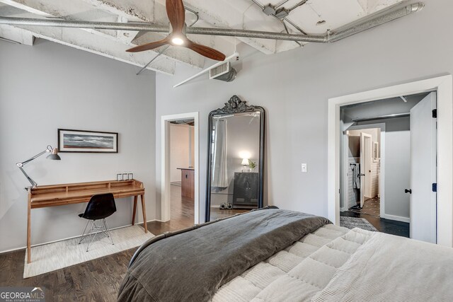 living room featuring ceiling fan, dark hardwood / wood-style flooring, and a high ceiling