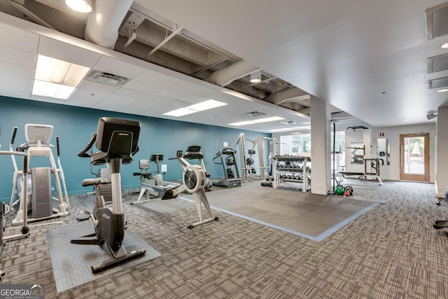 exercise room featuring plenty of natural light and carpet floors