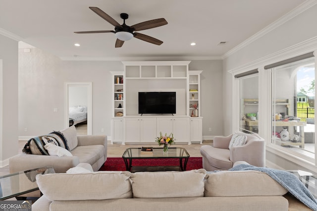 living room with ceiling fan, ornamental molding, and light hardwood / wood-style flooring