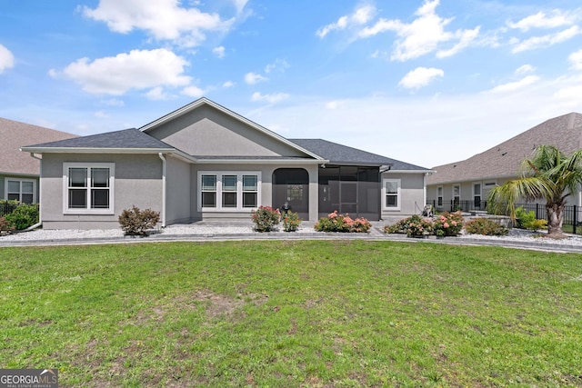 ranch-style house with a sunroom and a front yard