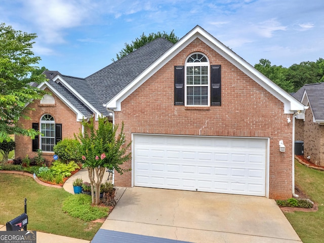 view of front property featuring a front yard and a garage