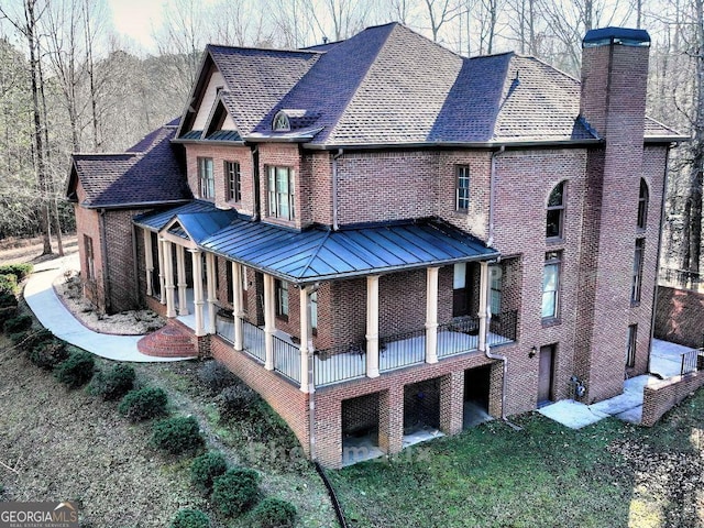 back of property featuring a porch