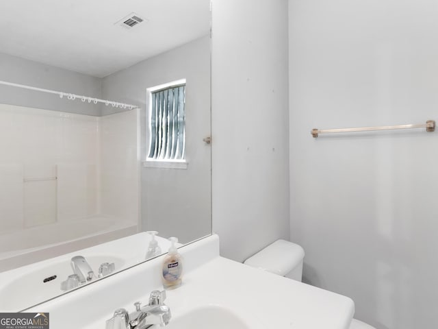 full bathroom featuring toilet, shower / bath combination, and sink